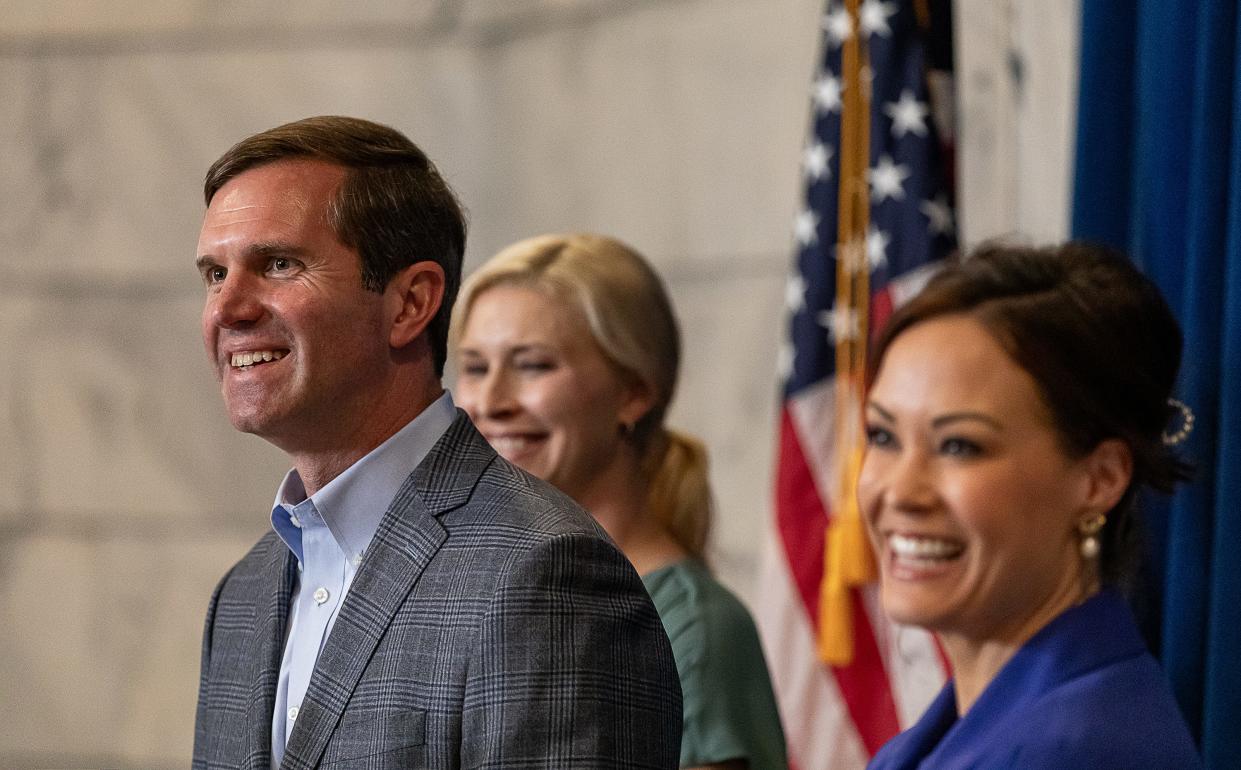 Gov. Andy Beshear, First Lady Britainy Beshear and Lieutenant Governor Jacqueline Coleman shared a laugh during a press conference in the aftermath of Beshear's election win over Daniel Cameron. Wed, Nov. 8, 2023