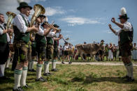 <p>Participants wearing traditional Bavarian lederhosen arrive for competing in the 2016 Muensing Oxen Race (Muensinger Ochsenrennen) on August 28, 2016 in Muensing, Germany. (Photo: Matej Divizna/Getty Images)</p>