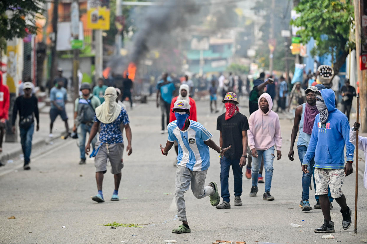 People in the middle of the street protest in Haiti.