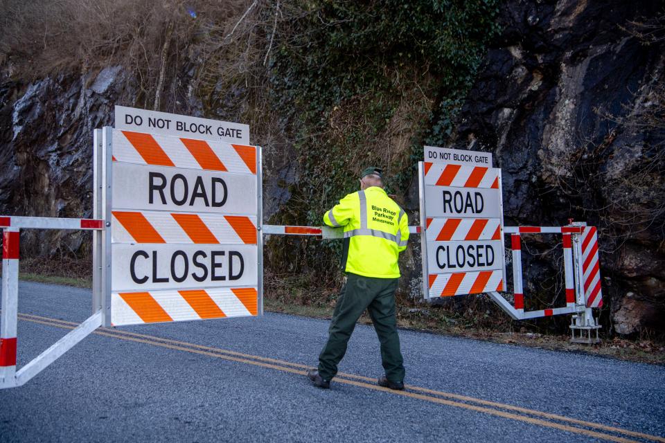 A Blue Ridge Parkway Maintenance employee closes a gate to the parkway after moving a truck through, December 11, 2023,