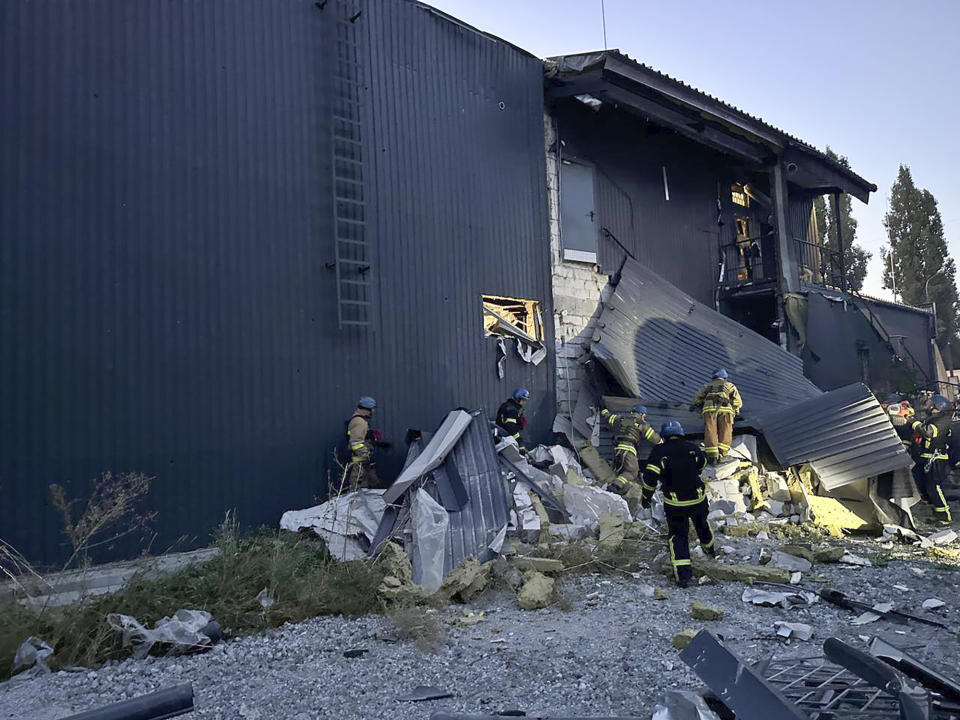 In this photo provided by the Zaporizhzhia administration Press Office, rescuers work on the scene of a building damaged after Russian missile strikes in Zaporizhzhia, Ukraine, Wednesday, Aug. 9, 2023. (Zaporizhzhia administration Press Office via AP)