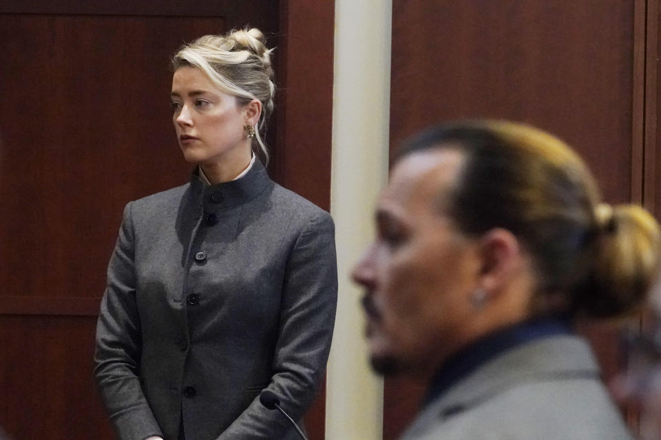 Actor Johnny Depp walks into the courtroom after a break at the Fairfax County Circuit Courthouse in Fairfax, Va., Monday, May 16, 2022. Depp sued his ex-wife Amber Heard for libel in Fairfax County Circuit Court after she wrote an op-ed piece in The Washington Post in 2018 referring to herself as a "public figure representing domestic abuse." (AP Photo/Steve Helber, Pool)