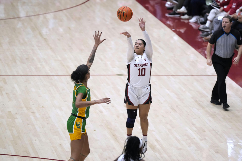 Stanford guard Talana Lepolo (10) takes a 3-point shot over Oregon guard Priscilla Williams (4) during the second half of an NCAA college basketball game Friday, Jan. 19, 2024, in Stanford, Calif. (AP Photo/Tony Avelar)