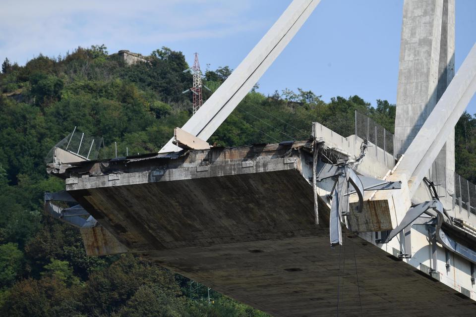 A view of the collapsed Morandi highway bridge, in Genoa, Italy, Friday, Aug. 17, 2018. Officials say 38 people are confirmed killed and 15 injured. Prosecutors say 10 to 20 people might be unaccounted-for and the death toll is expected to rise. (Luca Zennaro/ANSA via AP)