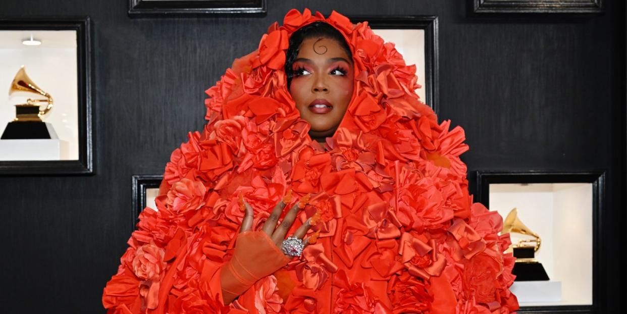 lizzo at grammys in orange flower outfit and orange nails