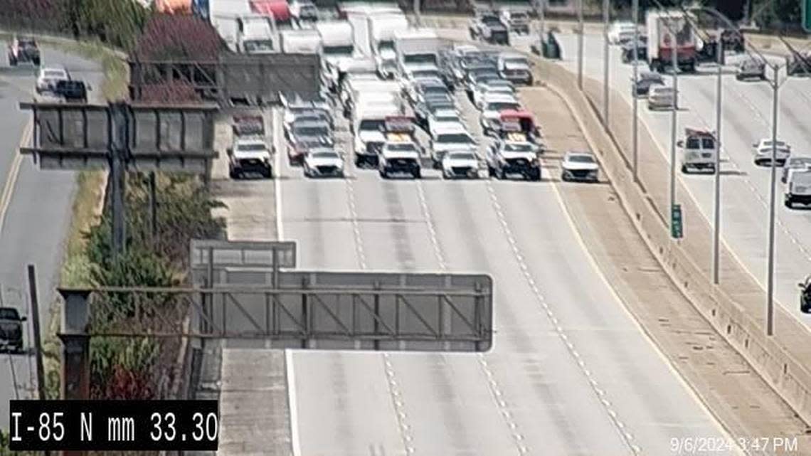 This screenshot of N.C. Department of Transportation camera footage shows traffic stopped in one direction on I-85 near the Charlotte-Douglas International Airport before former President Donald Trump’s arrival for a speech to the Fraternal Order of Police in the university area.