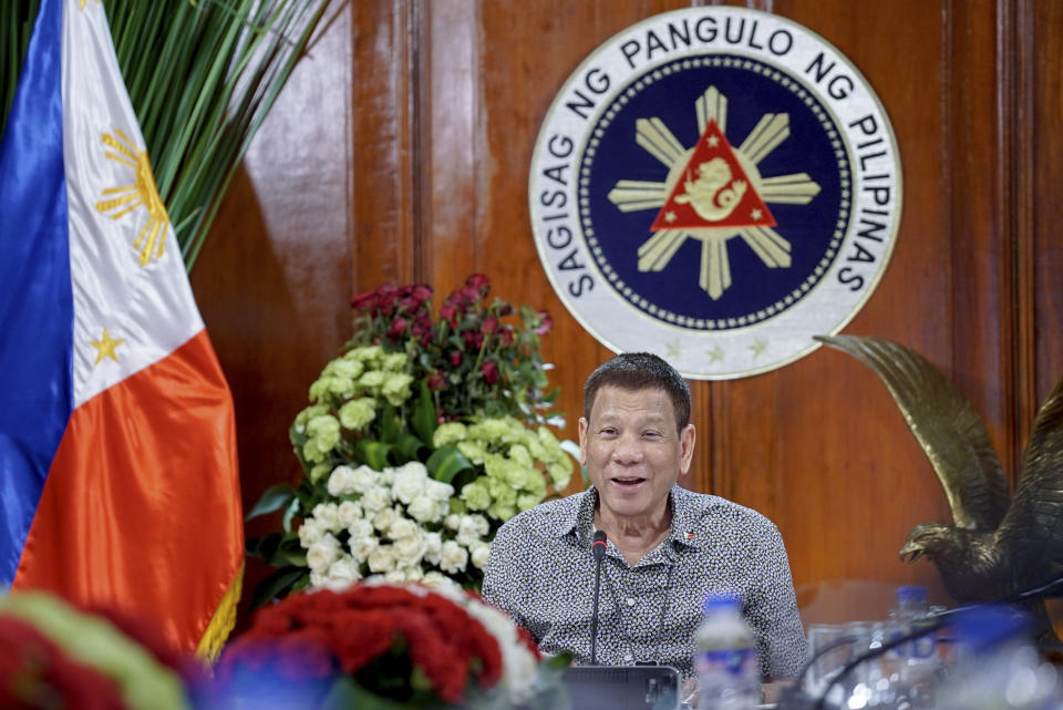 In this handout photo provided by the Malacanang Presidential Photographers Division, Philippine President Rodrigo Duterte meets members of the Inter-Agency Task Force on the Emerging Infectious Diseases at the Malacanang presidential palace in Manila, Philippines on Monday Aug. 30, 2020. Duterte publicly ordered the country's top customs official to shoot and kill drug smugglers in one of his most overt threats during a deadly four-year campaign that has been the centerpiece of his presidency. (King Rodriguez/ Malacanang Presidential Photographers Division via AP)