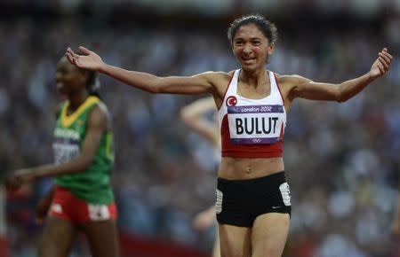 FILE PHOTO: Turkey's Gamze Bulut celebrates after her second place finish in her women's 1500m semi-final during the London 2012 Olympic Games at the Olympic Stadium August 8, 2012. REUTERS/Dylan Martinez