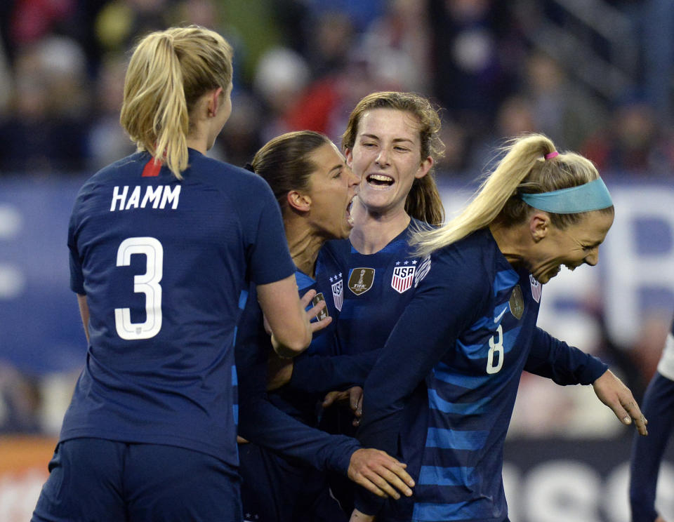 United States forward Tobin Heath, center, celebrates with teammates after scoring a goal against England during the second half of a SheBelieves Cup women's soccer match Saturday, March 2, 2019, in Nashville, Tenn. The United States and England played to a 2-2 draw. (AP Photo/Mark Zaleski)
