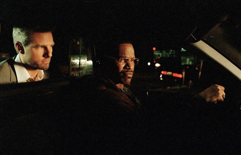 Jamie Foxx (right) plays a cab driver who gets tangled with an assassin (Tom Cruise) in Michael Mann's "Collateral."