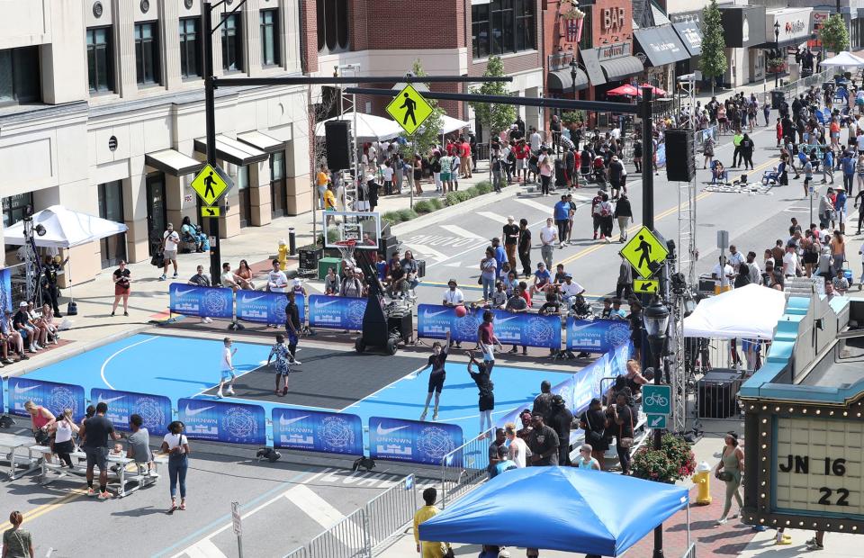 Basketball, shoes and a block party take over during the UNKNWN 3v3 Courtyard Classic basketball tournament featuring a pop-up basketball court on South Main Street in Akron.
