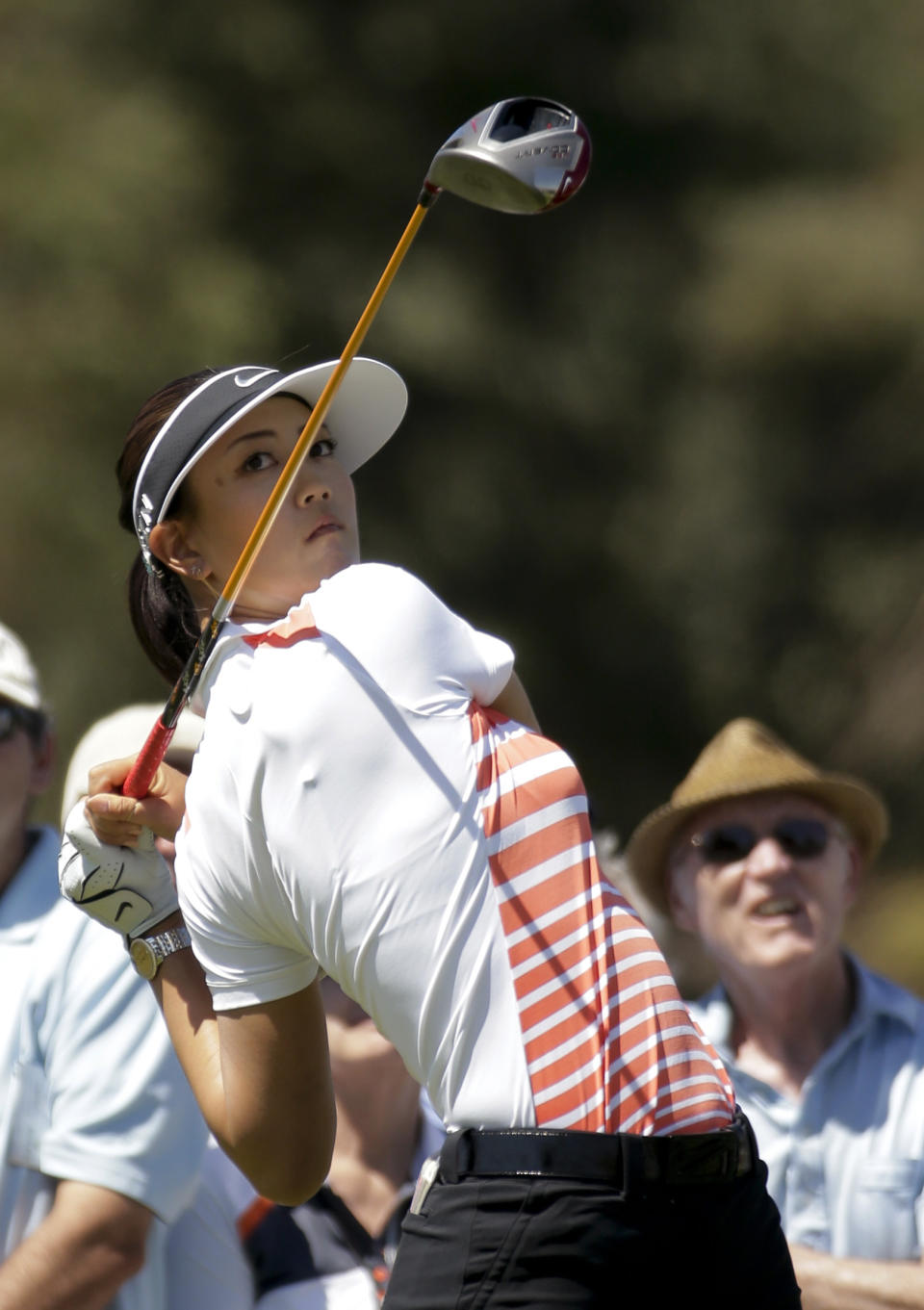 Michelle Wie watches her tee shot on the second hole during the third round of the Kraft Nabisco Championship golf tournament Saturday, April 5, 2014 in Rancho Mirage, Calif. (AP Photo/Chris Carlson)