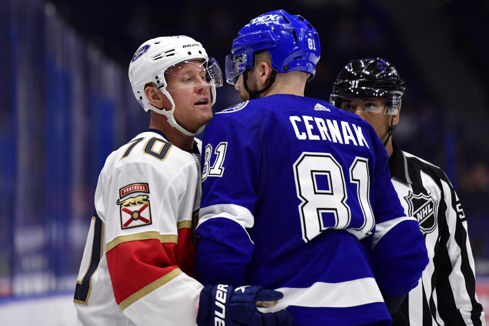 TAMPA, FLORIDA - APRIL 15: Erik Cernak #81 of the Tampa Bay Lightning exchanges words with Patric Hornqvist #70 of the Florida Panthers during the second period at Amalie Arena on April 15, 2021 in Tampa, Florida. (Photo by Douglas P. DeFelice/Getty Images)