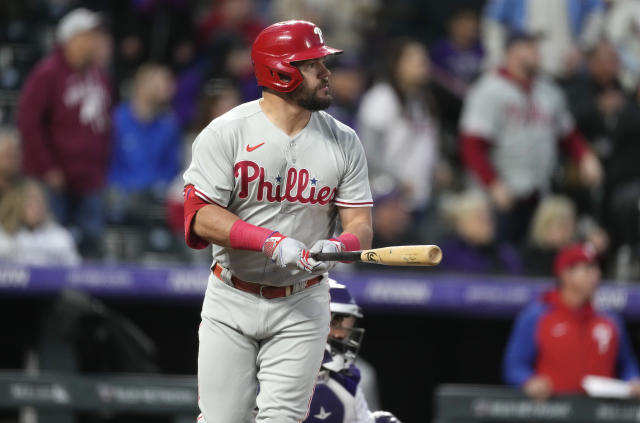 Philadelphia Phillies' Kyle Schwarber watches his two-run home run off Colorado Rockies starting pitcher Austin Gomber during the seventh inning of a baseball game Friday, May 12, 2023, in Denver. (AP Photo/David Zalubowski)