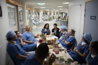 Nurses celebrate the New Year together in the COVID-19 intensive care unit at the la Timone hospital in Marseille, southern France, Saturday, Jan. 1, 2022. (AP Photo/Daniel Cole)