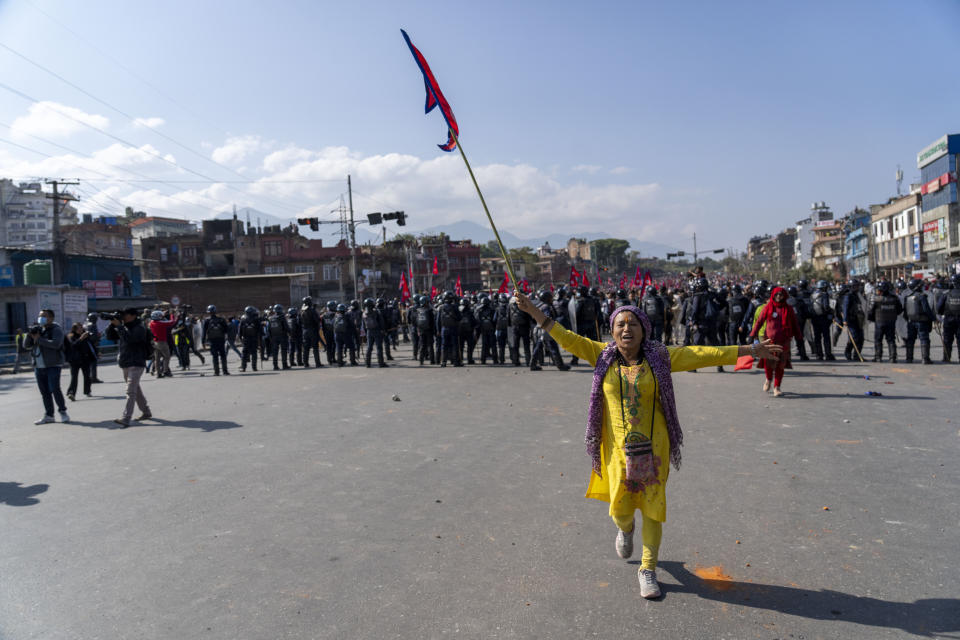 Protesters participate in a rally demanding a restoration of Nepal's monarchy in Kathmandu, Nepal, Thursday, Nov. 23, 2023. Riot police used batons and tear gas to halt tens of thousands of supporters of Nepal's former king demanding the restoration of the monarchy and the nation's former status as a Hindu state. Weeks of street protests in 2006 forced then King Gyanendra to abandon his authoritarian rule and introduce democracy. (AP Photo/Niranjan Shrestha)