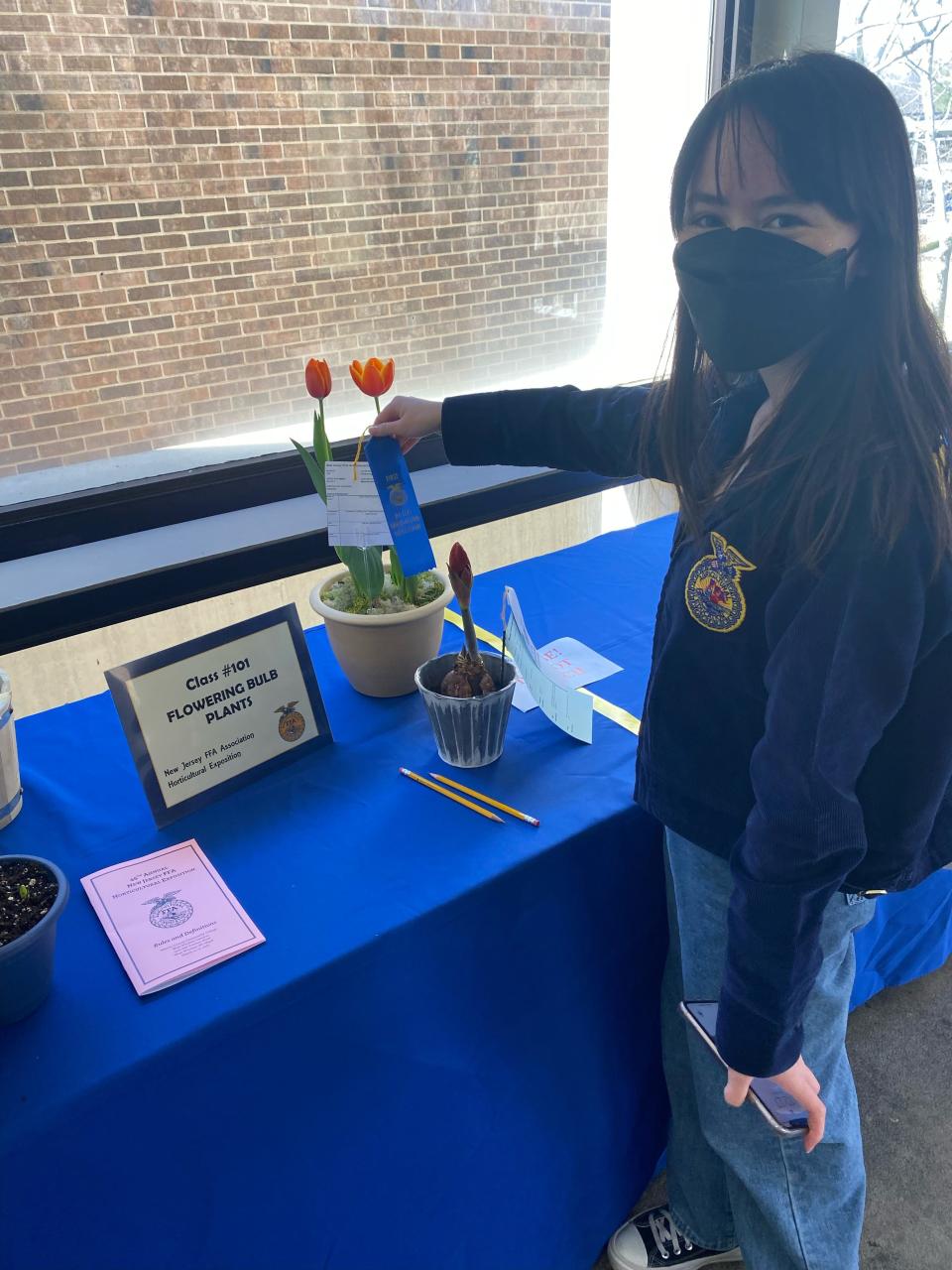 SCVTHS Agricultural Science sophomore Madeline Bates of Hillsborough poses for a photo with her winning entry in the Flowering Bulb Plants division.