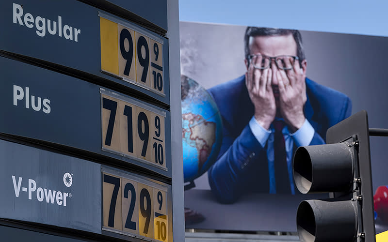 Gas prices are seen in front of a billboard advertising HBO’s “Last Week Tonight” in Los Angeles on March 7. The price of regular gasoline broke $4 per gallon on average across the U.S. for the first time since 2008. <em>Associated Press/Jae C. Hong</em>