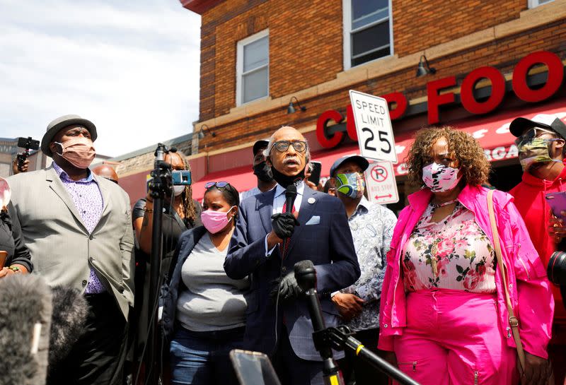 Civil rights leader Reverend Al Sharpton and Gwen Carr, mother of Eric Garner, lead a prayer at the site where African-American man George Floyd was fatally injured by police in Minneapolis