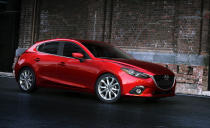 This publicity photo provided by Mazda North American Operations shows the 2014 Mazda3. The third generation Mazda3 small car, which goes on sale this fall, now has the same elegant swooping lines, elongated hood and narrow headlights of the larger Mazda6. The Mazda3 now has Mazda’s Skyactiv suite of fuel-saving technologies, including which includes lighter materials and a more efficient engine. (AP Photo/Mazda North American Operations)