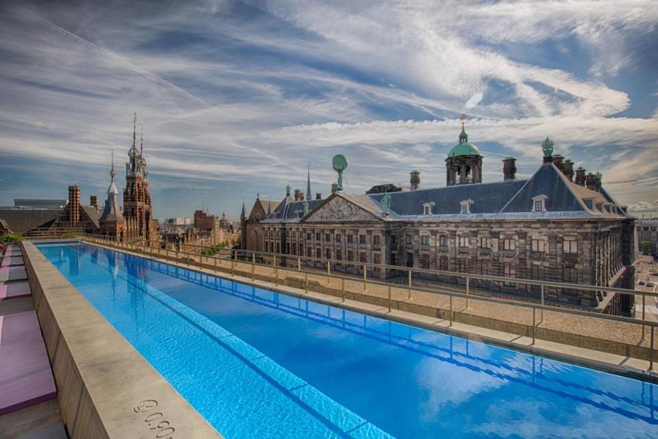 a pool with a building in the background