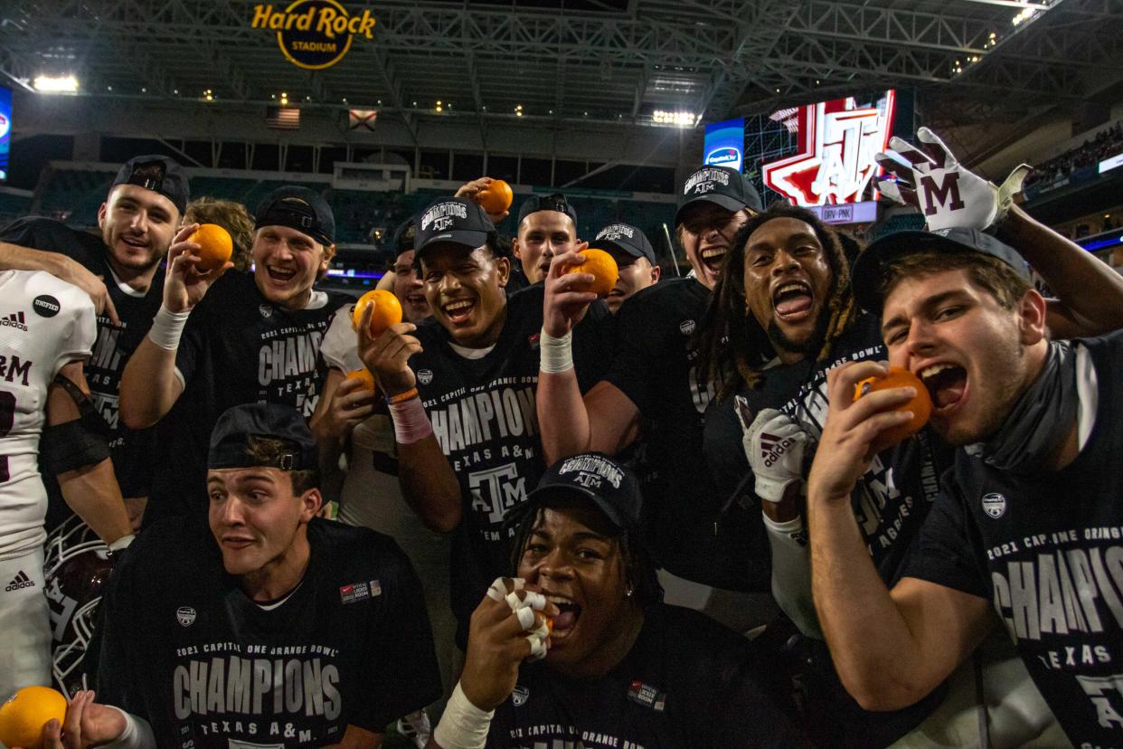 Aggies players celebrate their Orange Bowl victory over the Tar Heels in January.