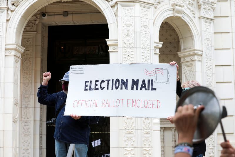 FILE PHOTO: Demonstration outside of the condo of Postmaster General Louis DeJoy, in Washington