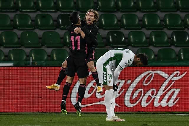 Real Madrid’s Luka Modric (centre) celebrates after scoring a goal