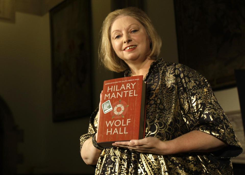 FILE - Winner of the 2009 Booker Prize for fiction Hilary Mantel with their book ' Wolf Hall ' poses for photographers following the announcement in central London, on Oct. 6, 2009. Mantel, the Booker Prize-winning author of the acclaimed “Wolf Hall” saga, has died, publisher HarperCollins said Friday Sept. 23, 2022. She was 70. (AP Photo/ Alastair Grant, File)