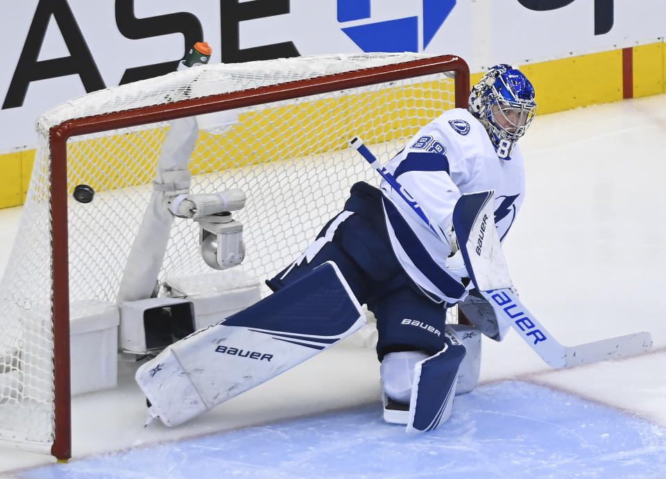 Tampa Bay Lightning goaltender Andrei Vasilevskiy (88) makes a save against the Florida Panthers during the third period of an exhibition NHL hockey game ahead of the Stanley Cup playoffs in Toronto on Wednesday, July 29, 2020. (Nathan Denette/The Canadian Press via AP)