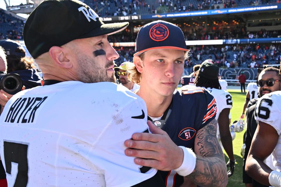 Las Vegas Raiders quarterback Brian Hoyer (7) and Chicago Bears quarterback Tyson Bagent (17) greet each other at midfield after their game at Soldier Field.