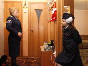 Anna (R), daughter of Russian Cossack Alexander Kriventsev, watches her mother Svetlana prepare before an Orthodox Christmas celebration, at home in the southern Russian city of Volgograd, January 7, 2014. REUTERS/Vasily Fedosenko