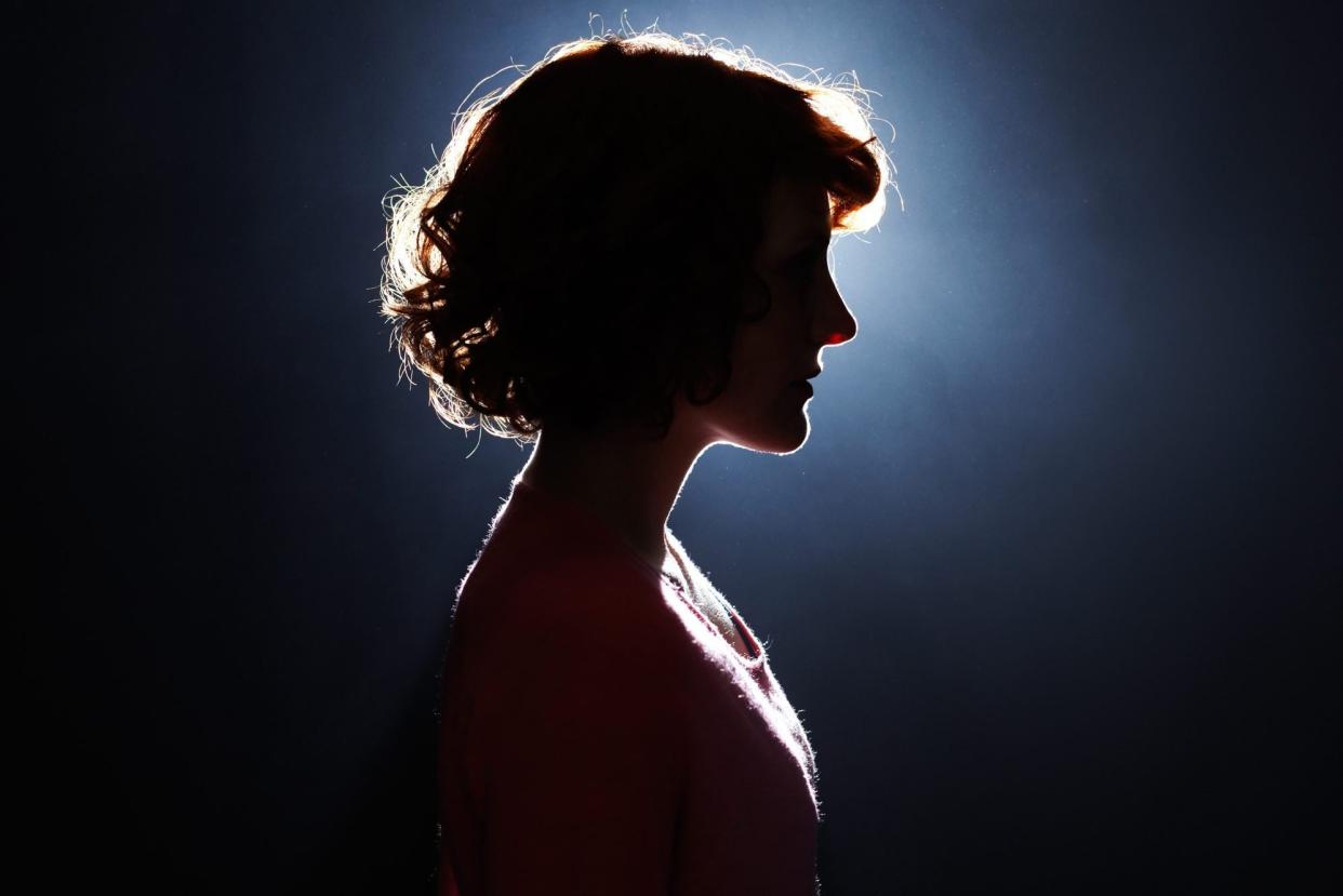 Silhouette of young woman.