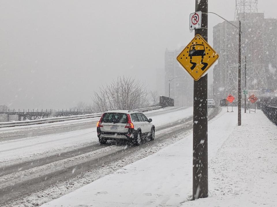 Snow accumulated on roadways in Windsor on Friday afternoon.