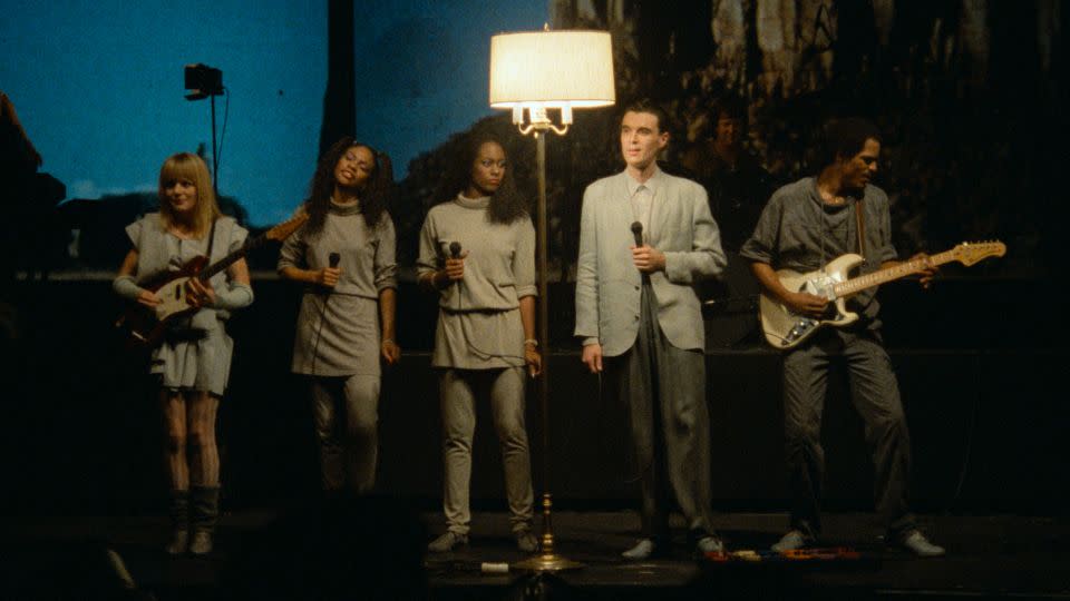 David Byrne (second from right) dances like nobody's watching in "Stop Making Sense." Dancing like him — flailing, stumbling, shimmying — is encouraged at "Stop Making Sense" showings. - Jordan Cronenweth/Courtesy of A24