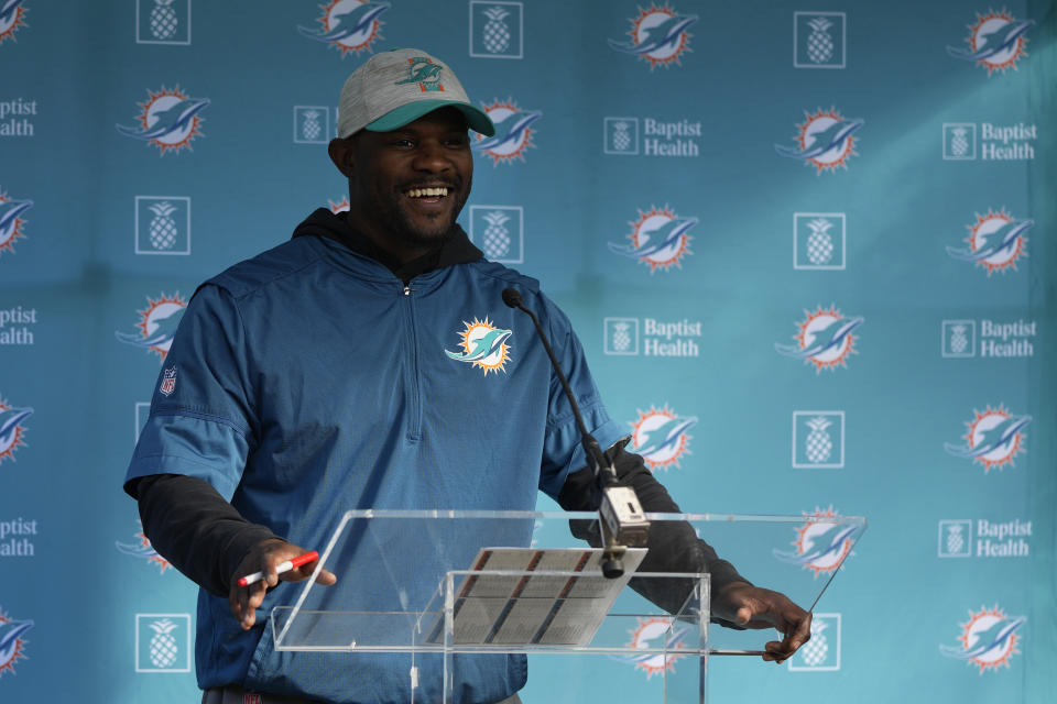 Brian Flores Head Coach of the Miami Dolphins speaks to the press during a practice and media availability by the Miami Dolphins In Ware, England, Friday, Oct. 15, 2021. The Dolphins play the Jaguars in a regular season NFL game on Sunday at Tottenham Hotspurs White Hart Lane stadium in London. (AP Photo/Alastair Grant)