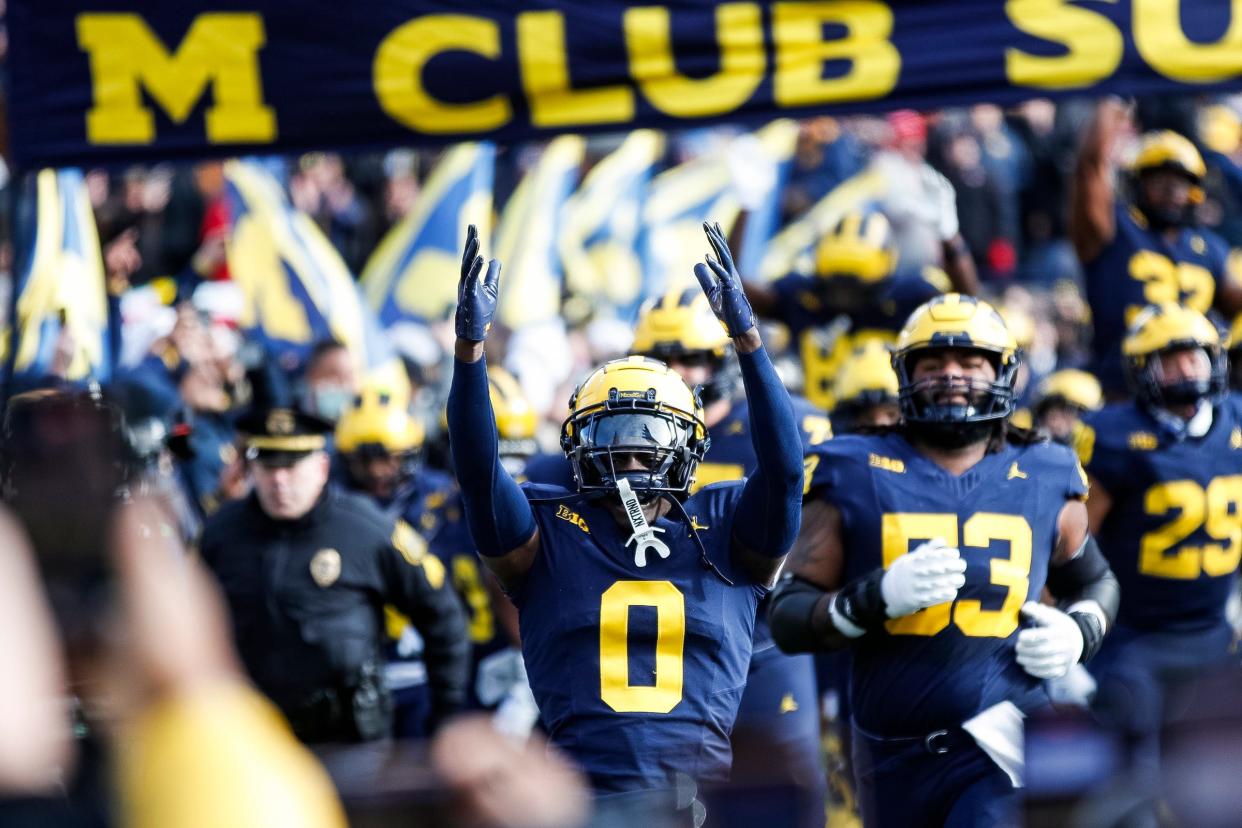 Michigan defensive back Mike Sainristil (0) and teammates take the field against Ohio State at Michigan Stadium in Ann Arbor on Saturday, Nov. 25, 2023.