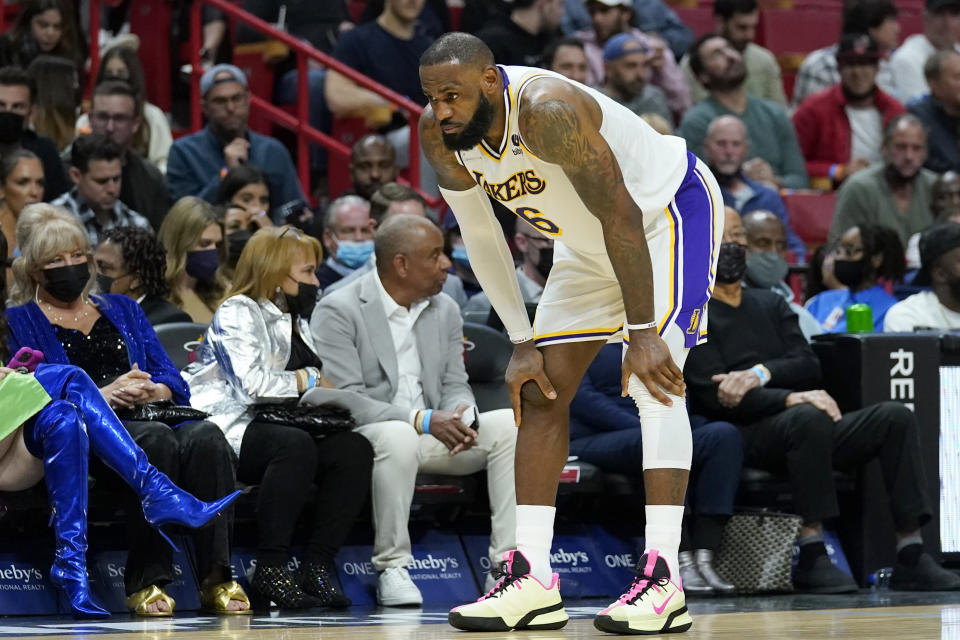 Los Angeles Lakers forward LeBron James (6) takes a break on the court during the second half of an NBA basketball game against the Miami Heat, Sunday, Jan. 23, 2022, in Miami. Miami won 113-107. (AP Photo/Lynne Sladky)