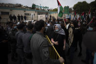 Israeli border police stand guard during a demonstration against a visit of Israeli Prime Minister Benjamin Netanyahu to the northern Arab city of Nazareth, Israel, Wednesday, Jan. 13, 2021. Netanyahu, who has spent much of his long career casting Israel's Arab minority as a potential fifth column led by terrorist sympathizers, is now openly courting their support as he seeks reelection in the country's fourth vote in less than two years. (AP Photo/Sebastian Scheiner)