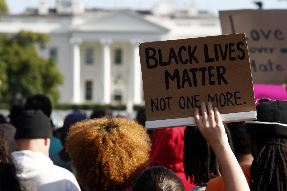 Demonstrators gather to protest the death of George Floyd, Sunday, May 31, 2020, near the White House in Washington. Floyd died after being restrained by Minneapolis police officers (AP Photo/Alex Brandon)