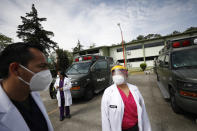 Dr. Marta Beatriz Sanchez, who returned to work Tuesday after recovering from a coronavirus infection, stands outside the COVID-19 hospital in Military Camp 1 after an earthquake was felt, in Naucalpan, Mexico State, part of the Mexico City metropolitan area, Tuesday, June 23, 2020. On the grounds of the military base, a barracks has been converted into a 100-bed hospital treating recovering and moderately ill COVID-19 patients who come from both the military and civilian populations. (AP Photo/Rebecca Blackwell)