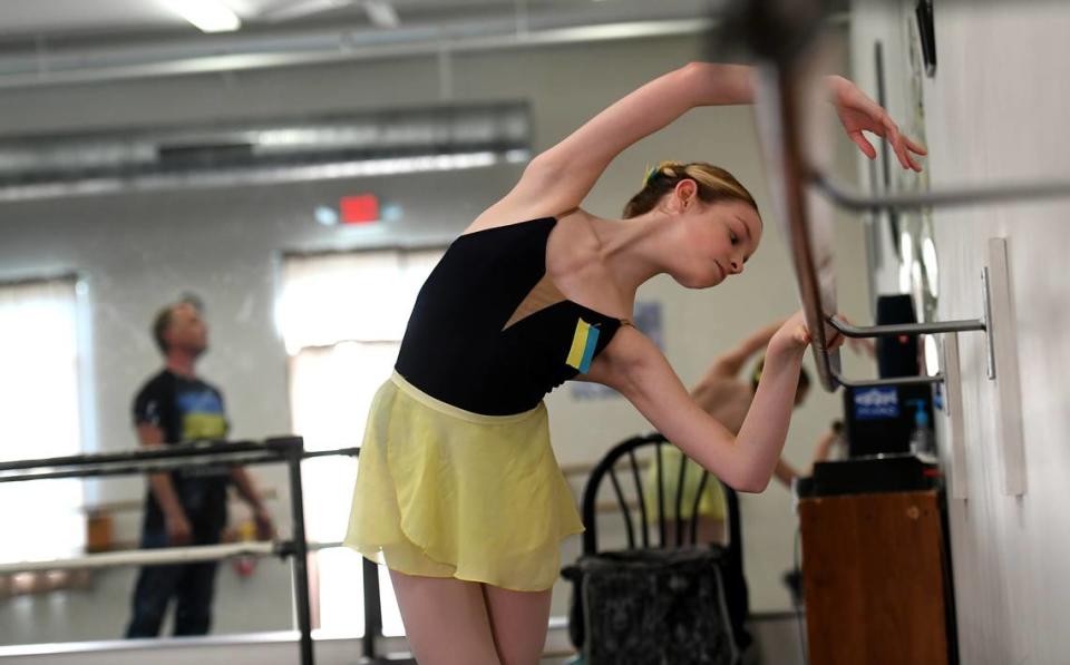 Lilly Wheeler wears the colors of Ukraine, blue and yellow, on her leotard and pinned to her hair as she trains at The International Ballet of Florida in University Park on March 3, 2022. The owners of the school quickly changed the name from The School of Russian Ballet in reaction to Russia’s invasion of Ukraine.