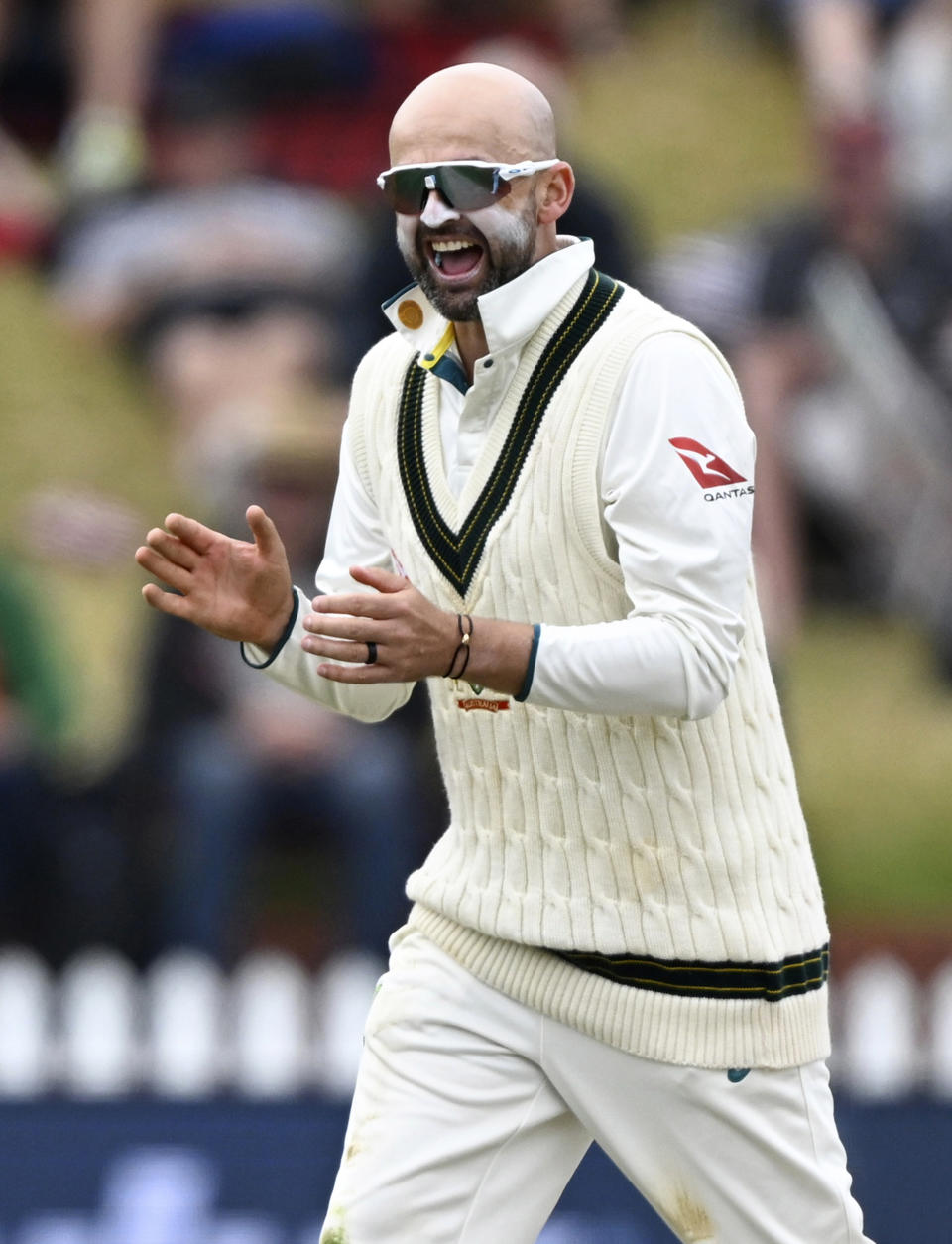 Australia's Nathan Lyon celebrates taking the wicket of New Zealand Rachin Ravindra on the fourth day of their cricket test match in Wellington, New Zealand, Sunday, March 3, 2024. (Andrew Cornaga/Photosport via AP)