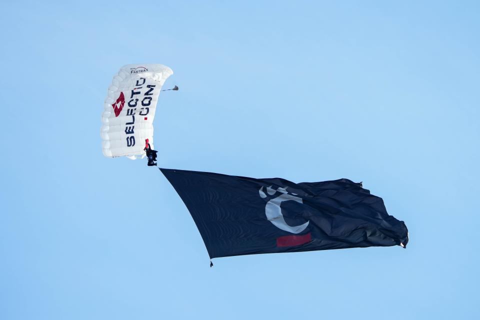 Sky divers land in Nippert Stardium before the UC vs. UCF game on Saturday November 4, 2023. UC looks for their first Big 12 win Saturday, Nov. 11 at Houston.