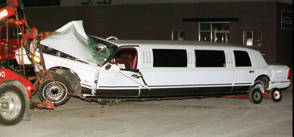 FILE--The limousine driven by Richard Gnida that was involved in a June 13, 1997, accident which left two members of the Detroit Red Wings organization injured is hauled into a towing company's lot in Birmingham, Mich., the next day. Vladimir Konstantinov and a team masseur were seriously injured in the accident. Konstantinov is in danger of losing the 24/7 care he has had for two-plus decades. The disabled former NHL defenseman is a casualty of changes to Michigan's auto insurance law that curbed or cut what hospitals, residential care facilities and home providers can charge car insurers for care. (AP Photo/Andrew Cutraro, File)