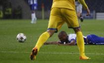 Porto's Yacine Brahimi lies on the pitch during their Champions League Group H soccer match against BATE Borisov at Dragao stadium in Porto September 17, 2014. REUTERS/Rafael Marchante