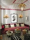<p>Calling upon the embellished military tents treasured by African, Middle Eastern, and Roman leaders, Martyn Bullard Lawrence used an ikat print (Mariam Ikat) to give the room the illusion of more interesting architecture. Rounding out the boho feel, the California decorator paired vintage tea tables with lustrous embellishments. </p>