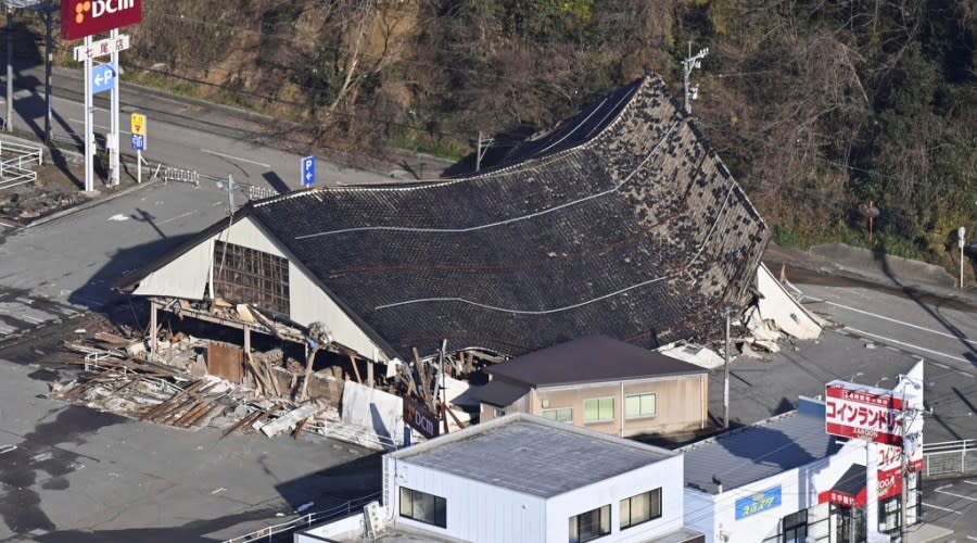 A house damaged by an earthquake sits in Nanao, Ishikawa prefecture, Japan Tuesday, Jan. 2, 2024. A series of powerful earthquakes hit western Japan, damaging buildings, vehicles and boats, with officials warning people in some areas on Tuesday to stay away from their homes because of a continuing risk of major quakes. (Kyodo News via AP)