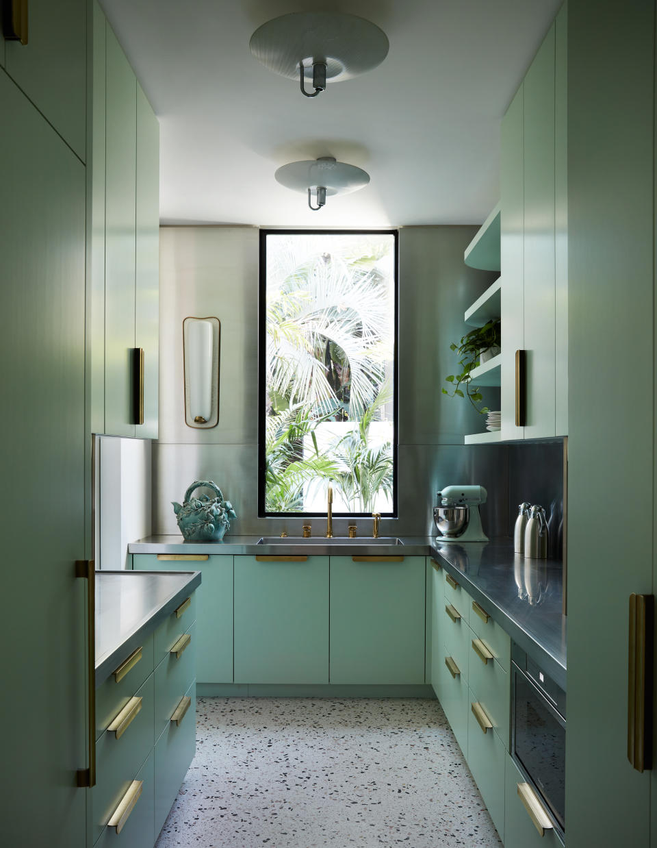 green kitchen with terrazzo floor