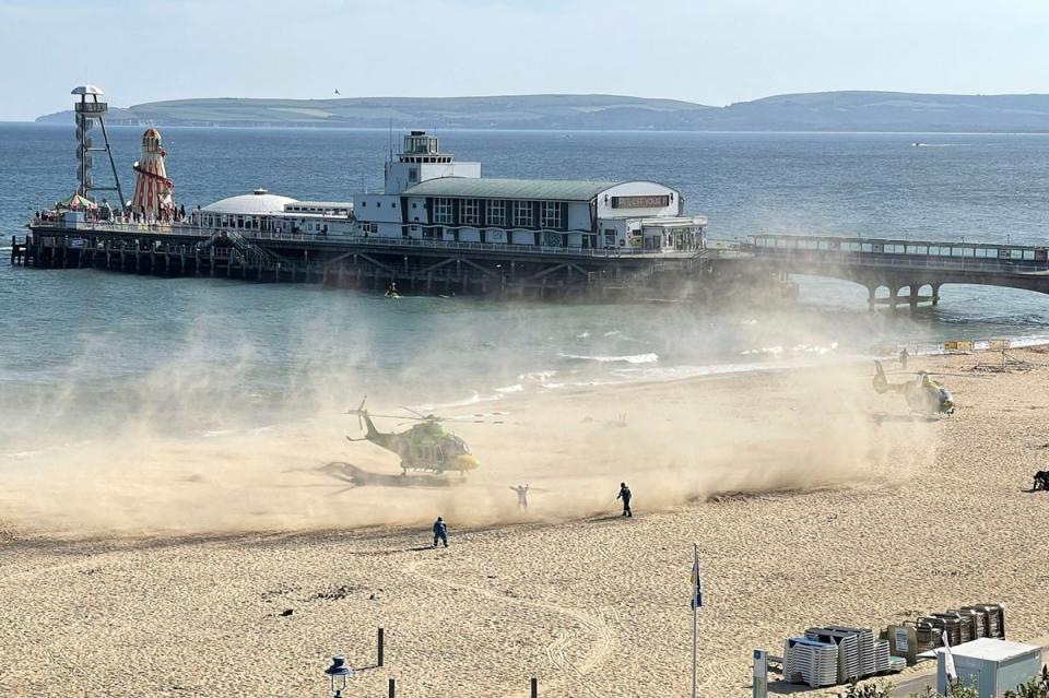 Air ambulances at the scene on Wednesday (PA)